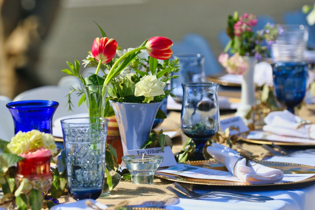 Table decorated with blue glassware