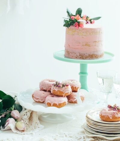 Pink layered cake on pale green cake stand